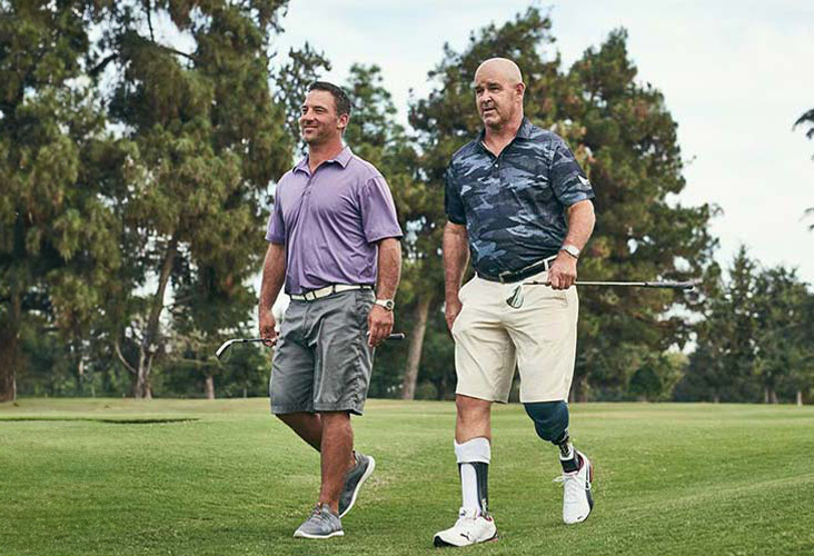 golfers walking on a course with the Proprio Foot