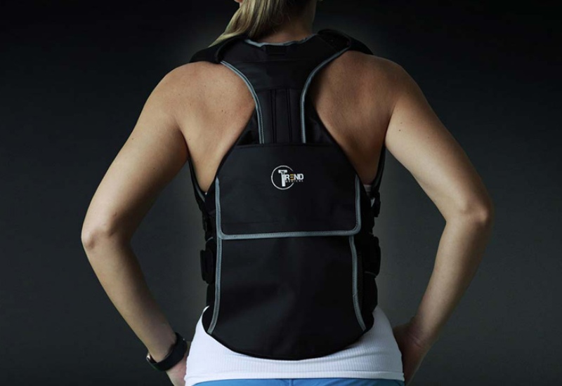 A woman is wearing a back brace for spine injury relief in New York, New Jersey, & Connecticut